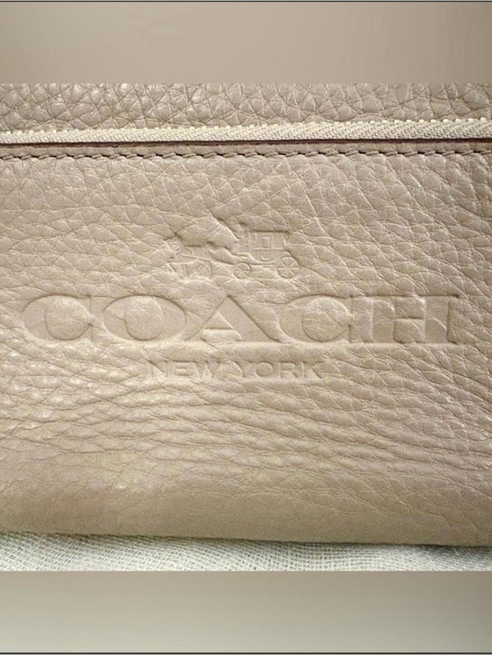 COACH Pebbled Leather wristlet in Taupe